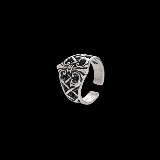 Antiqued silver anchor ring on a black background