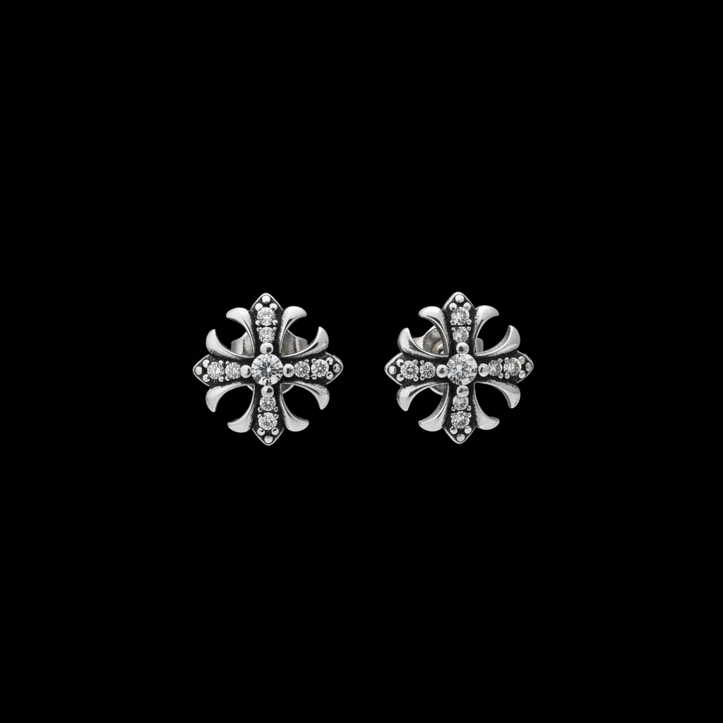 Pair of gothic pave cross stud earrings on a black background